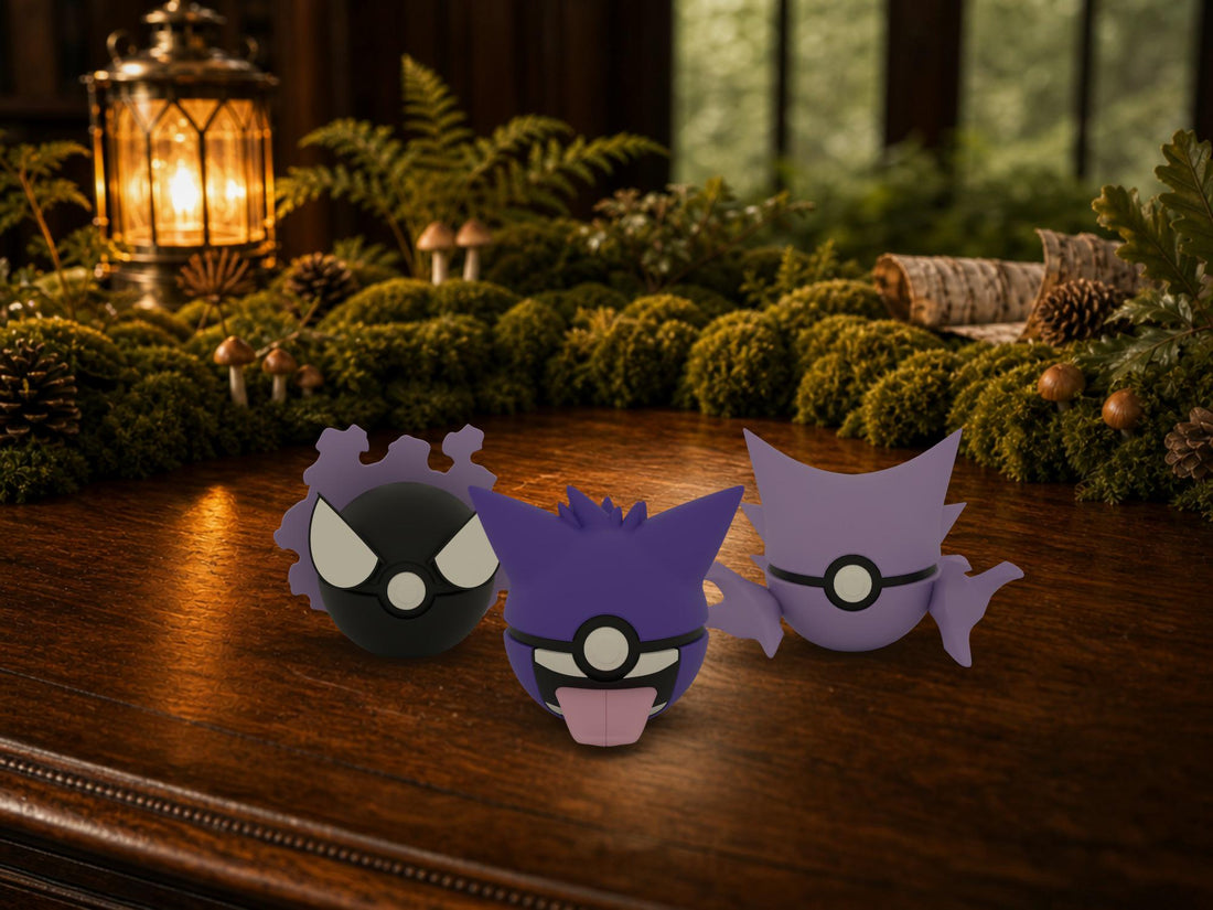 Gastly, Haunter and Gengar N3D Poké Balls on a woodland study desk, 3D printed Pokeball clicker evolution line