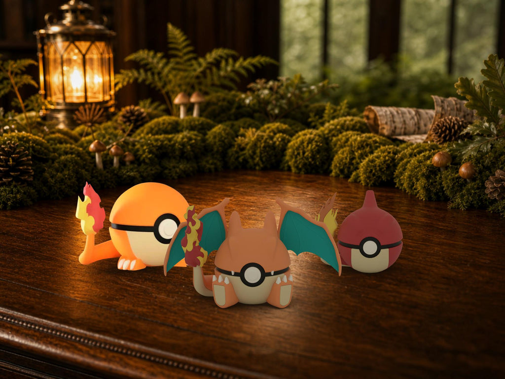 Charmander, Charmeleon and Charizard N3D Poké Balls on a woodland study desk, 3D printed Pokeball clicker evolution line