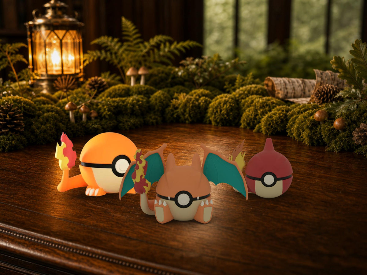 Charmander, Charmeleon and Charizard N3D Poké Balls on a woodland study desk, 3D printed Pokeball clicker evolution line