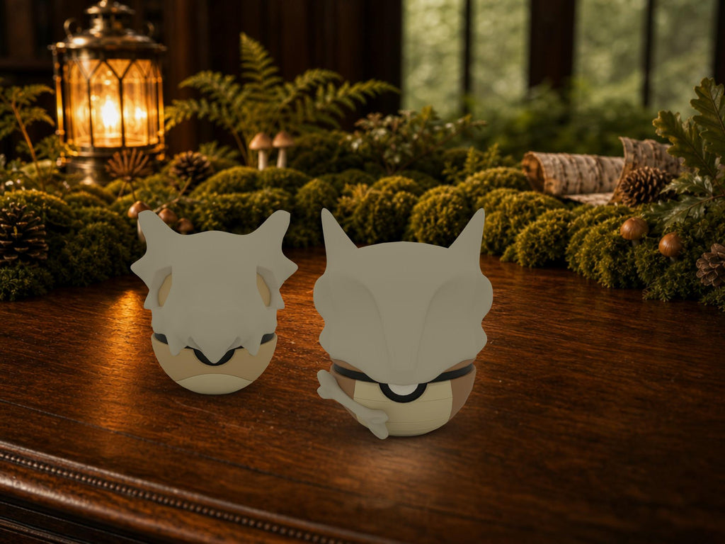 Cubone and Marowak N3D Poké Balls on a woodland study desk, 3D printed Pokeball clicker evolution line