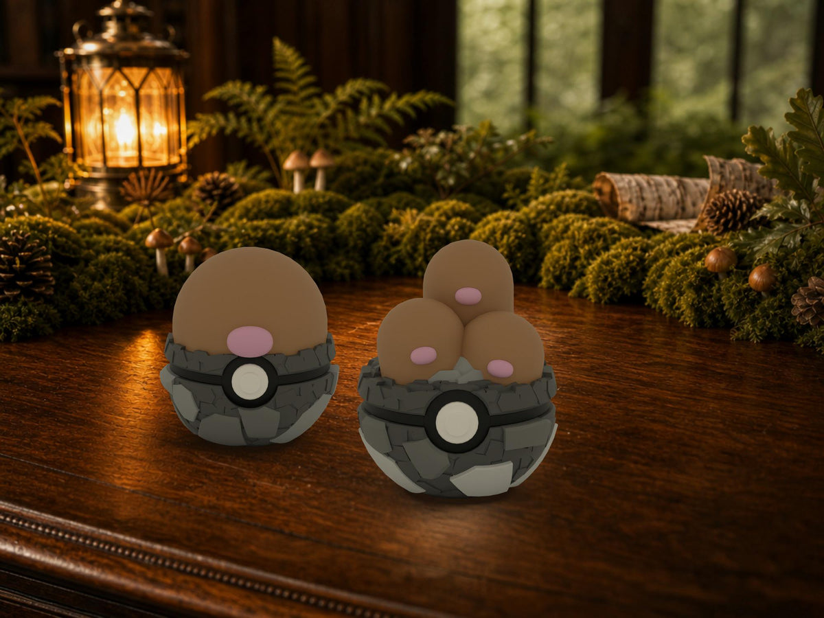 Diglett and Dugtrio N3D Poké Balls on a woodland study desk, 3D printed Pokeball clicker evolution line