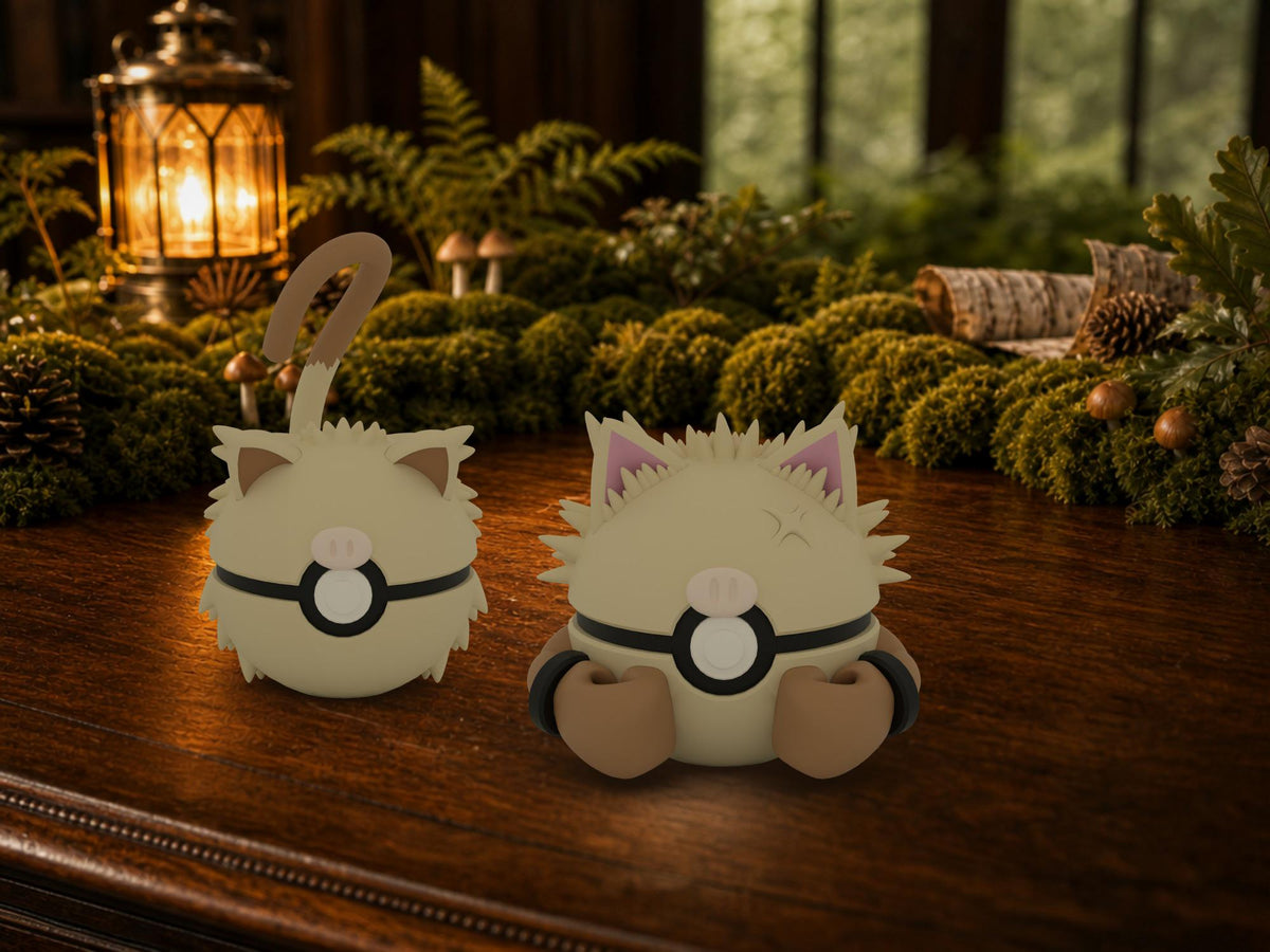 Mankey and Primeape N3D Poké Balls on a woodland study desk, 3D printed Pokeball clicker evolution line