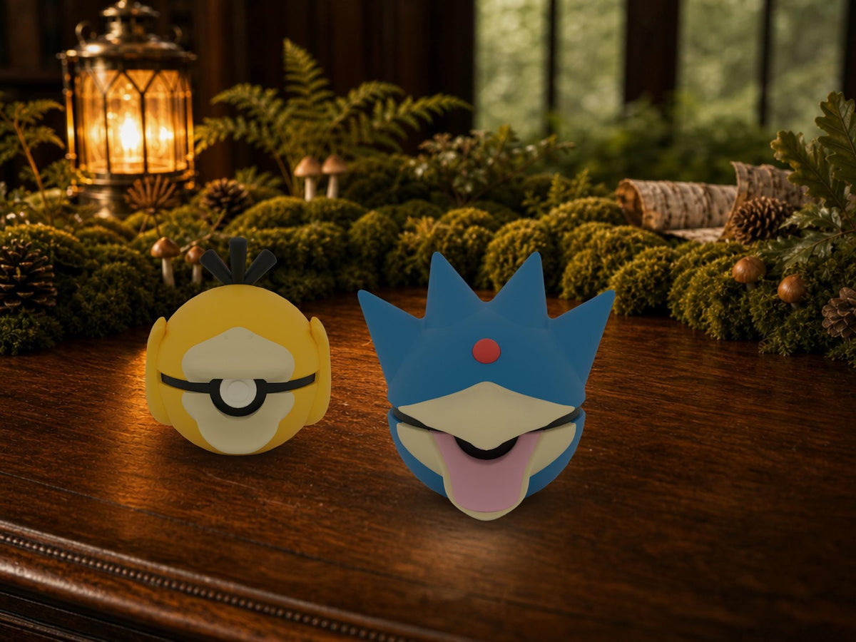 Psyduck and Golduck N3D Poké Balls on a woodland study desk, 3D printed Pokeball clicker evolution line
