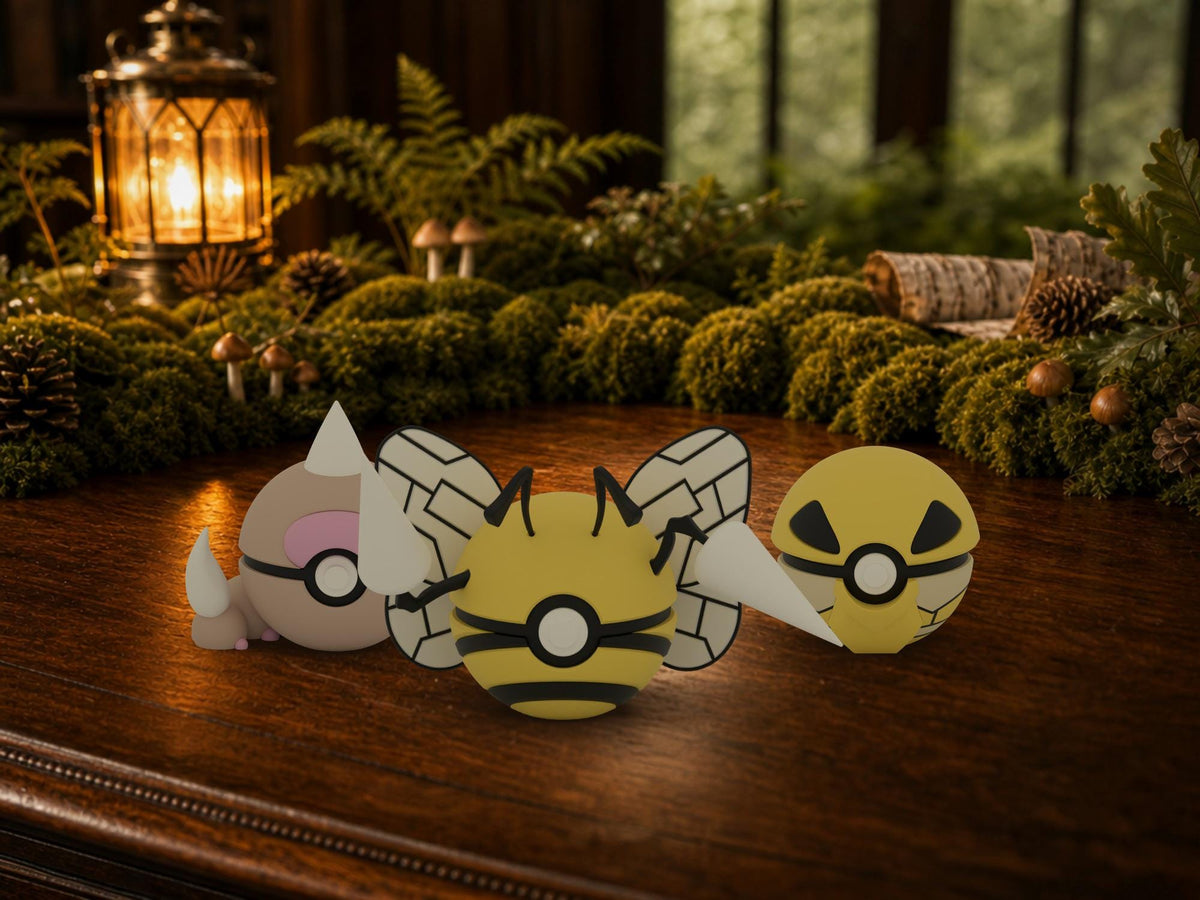 Weedle, Kakuna and Beedrill N3D Poké Balls on a woodland study desk, 3D printed Pokeball clicker evolution line