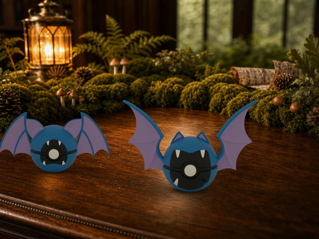 Zubat and Golbat N3D Poké Balls on a woodland study desk, 3D printed Pokeball clicker evolution line